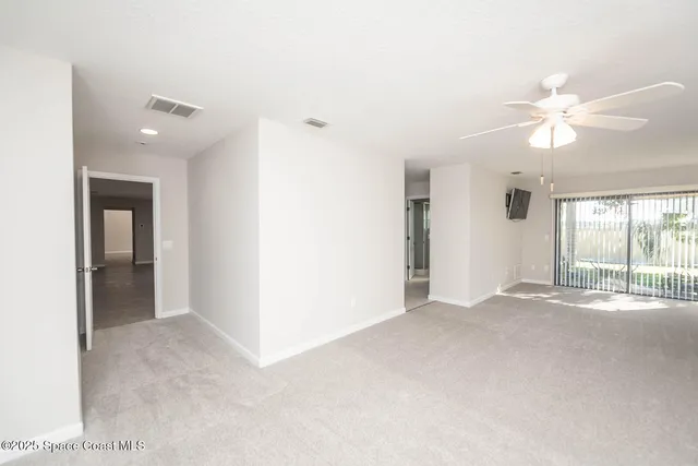 a spacious bathroom with a shower sink and mirror