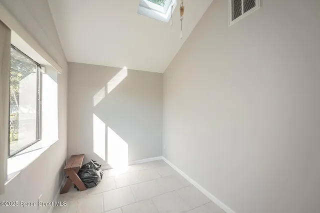 a spacious bathroom with a bathtub sink and mirror