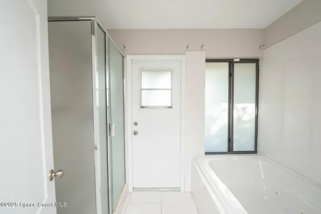 a bathroom with a toilet a sink and a mirror