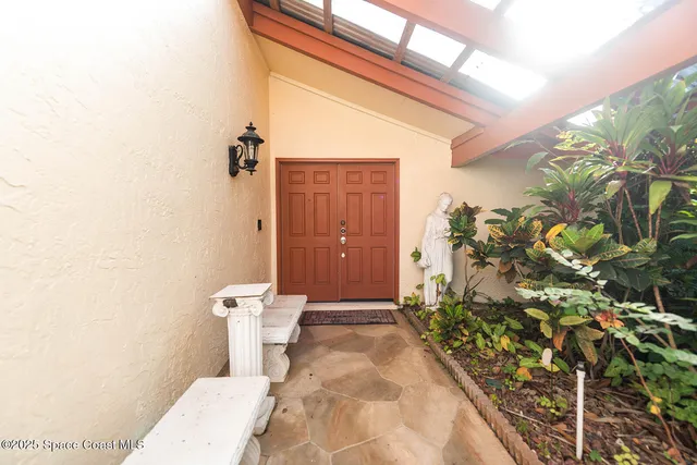 a view of a closet area with living room
