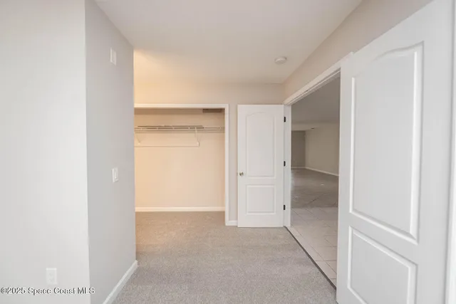 a view of a house with a tree in the background