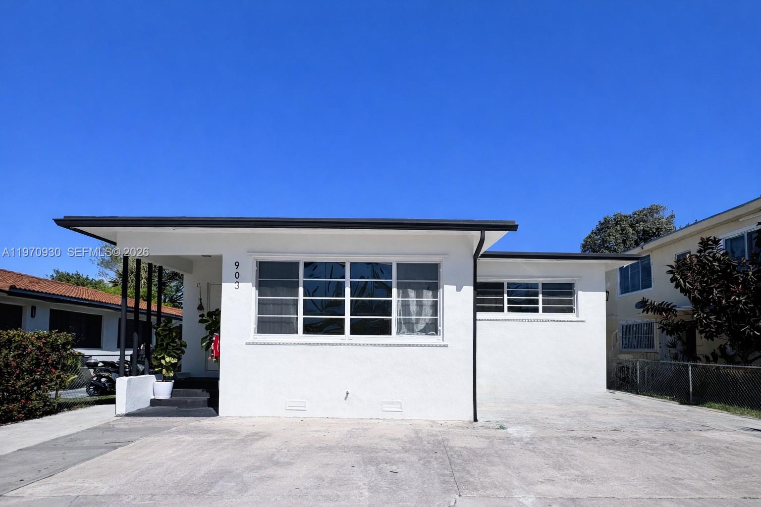 903 80th Street Miami Beach, FL 33141 - Photo 1 of 15 a view of a house with a backyard