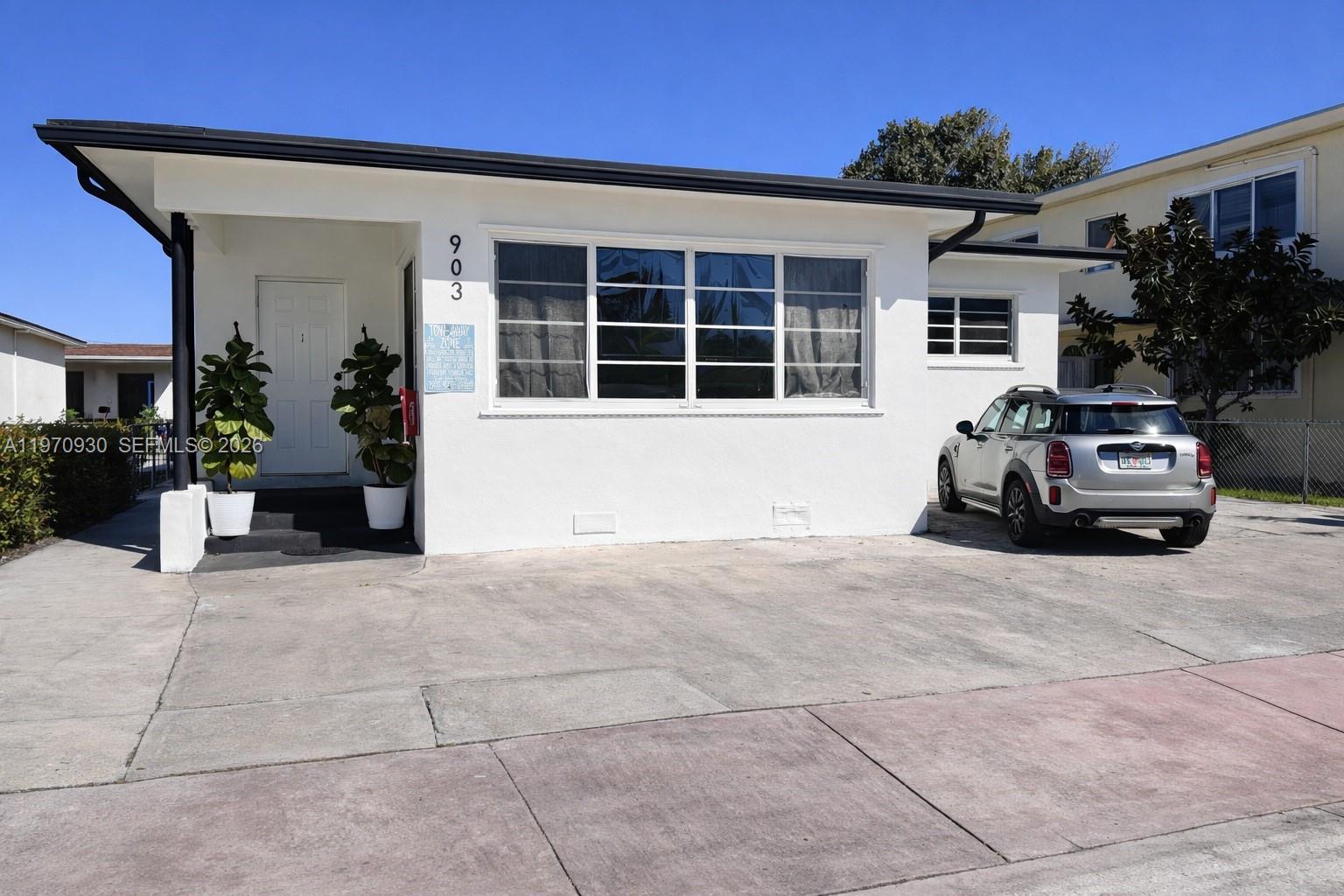 903 80th Street Miami Beach, FL 33141 - Photo 13 of 15 a car parked in front of house