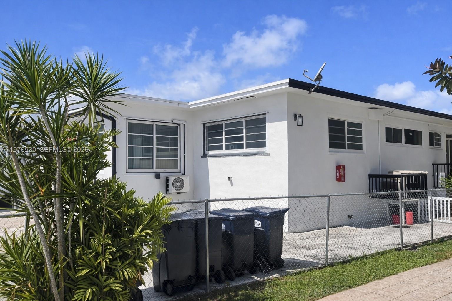 903 80th Street Miami Beach, FL 33141 - Photo 14 of 15 a front view of a house with a porch