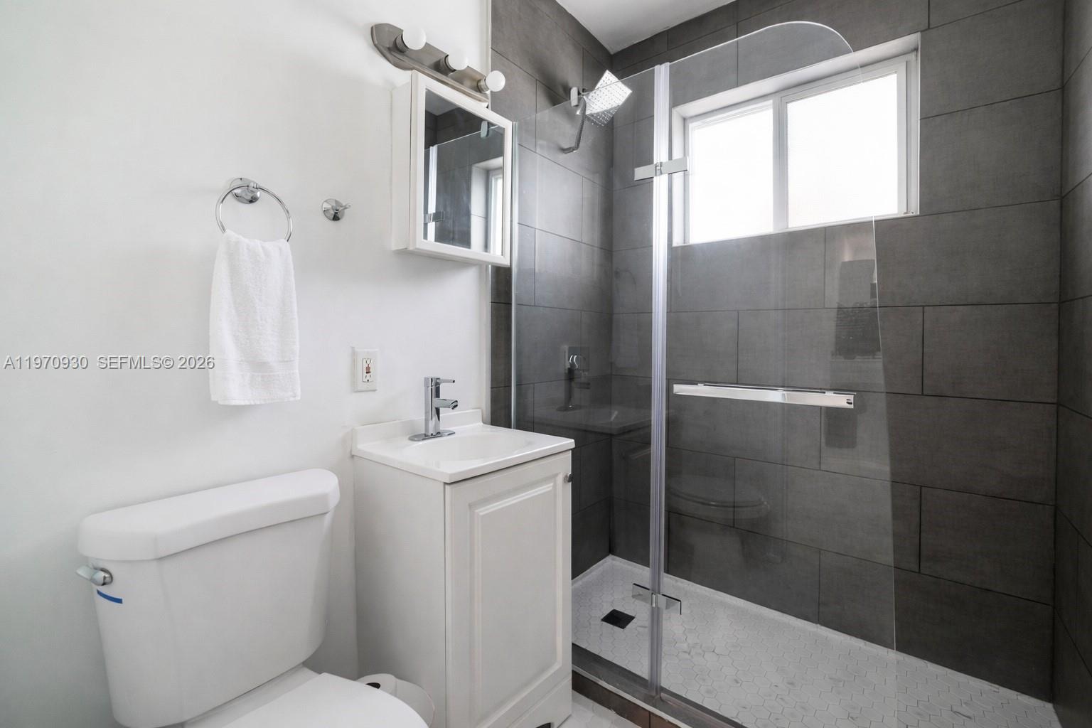 903 80th Street Miami Beach, FL 33141 - Photo 8 of 15 a bathroom with a sink toilet and shower