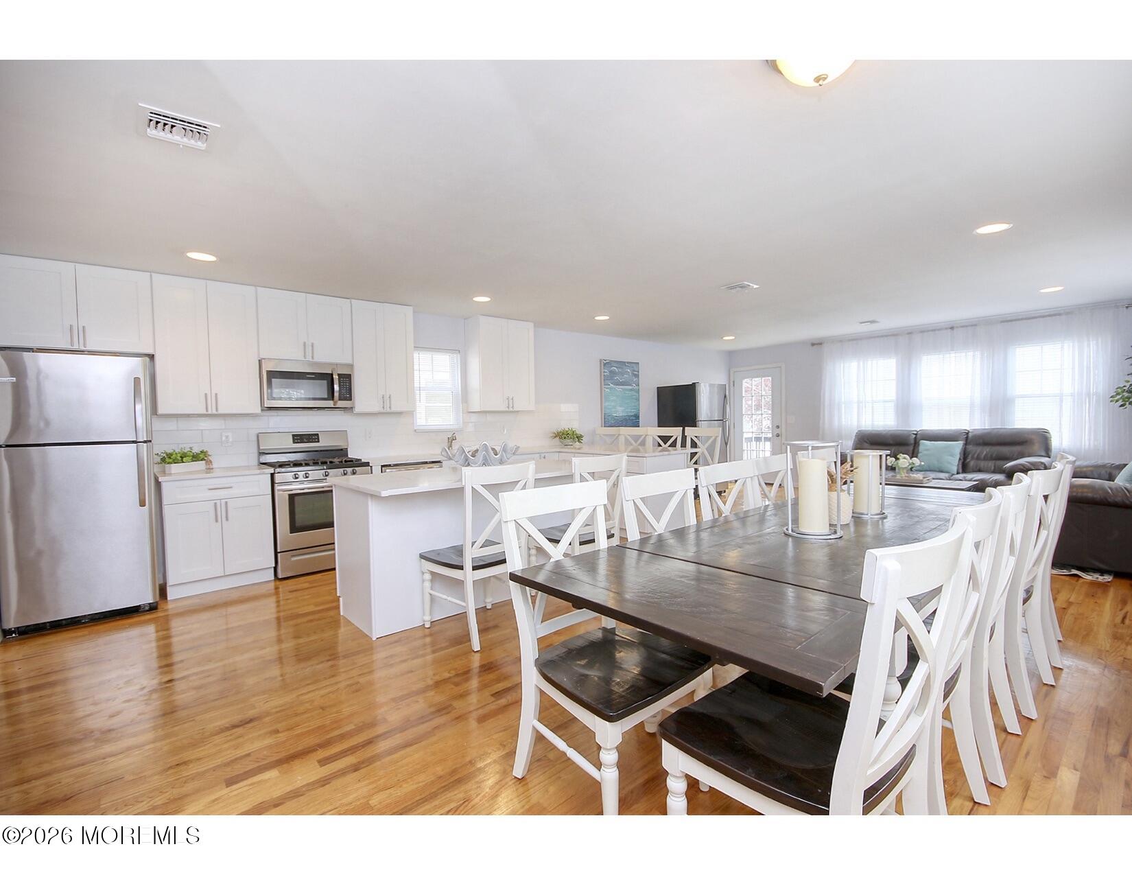 201 Arnold Avenue Point Pleasant Beach, NJ 08742 - Photo 14 of 33 a kitchen with stainless steel appliances granite countertop a stove refrigerator and cabinets