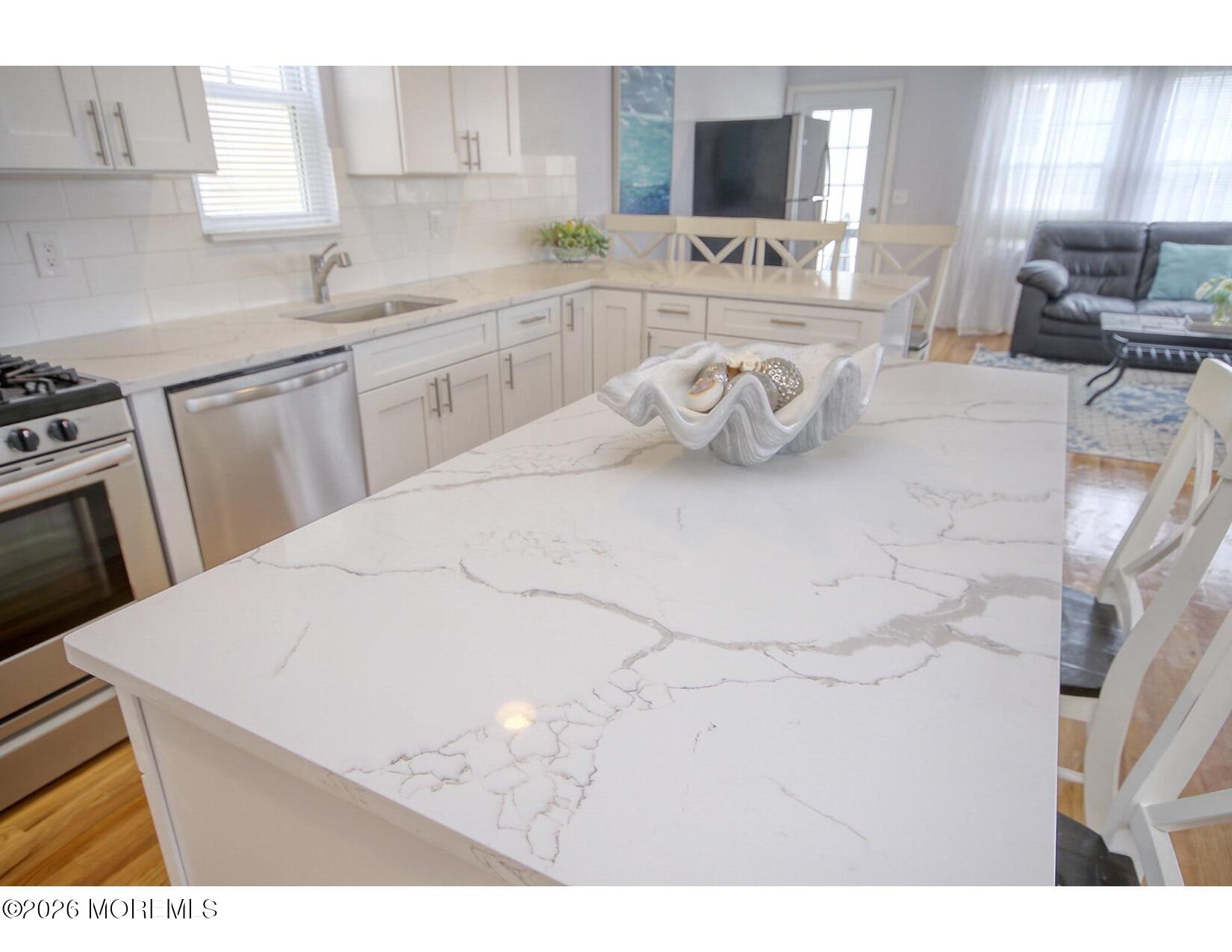 201 Arnold Avenue Point Pleasant Beach, NJ 08742 - Photo 16 of 33 a kitchen with stainless steel appliances cabinets a sink and a stove