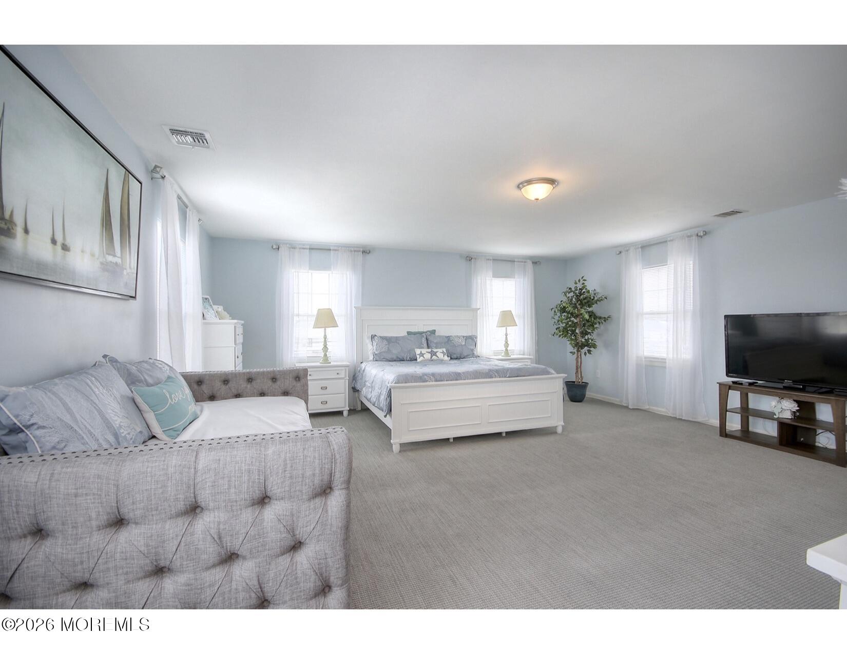 201 Arnold Avenue Point Pleasant Beach, NJ 08742 - Photo 20 of 33 a living room with furniture and a flat screen tv