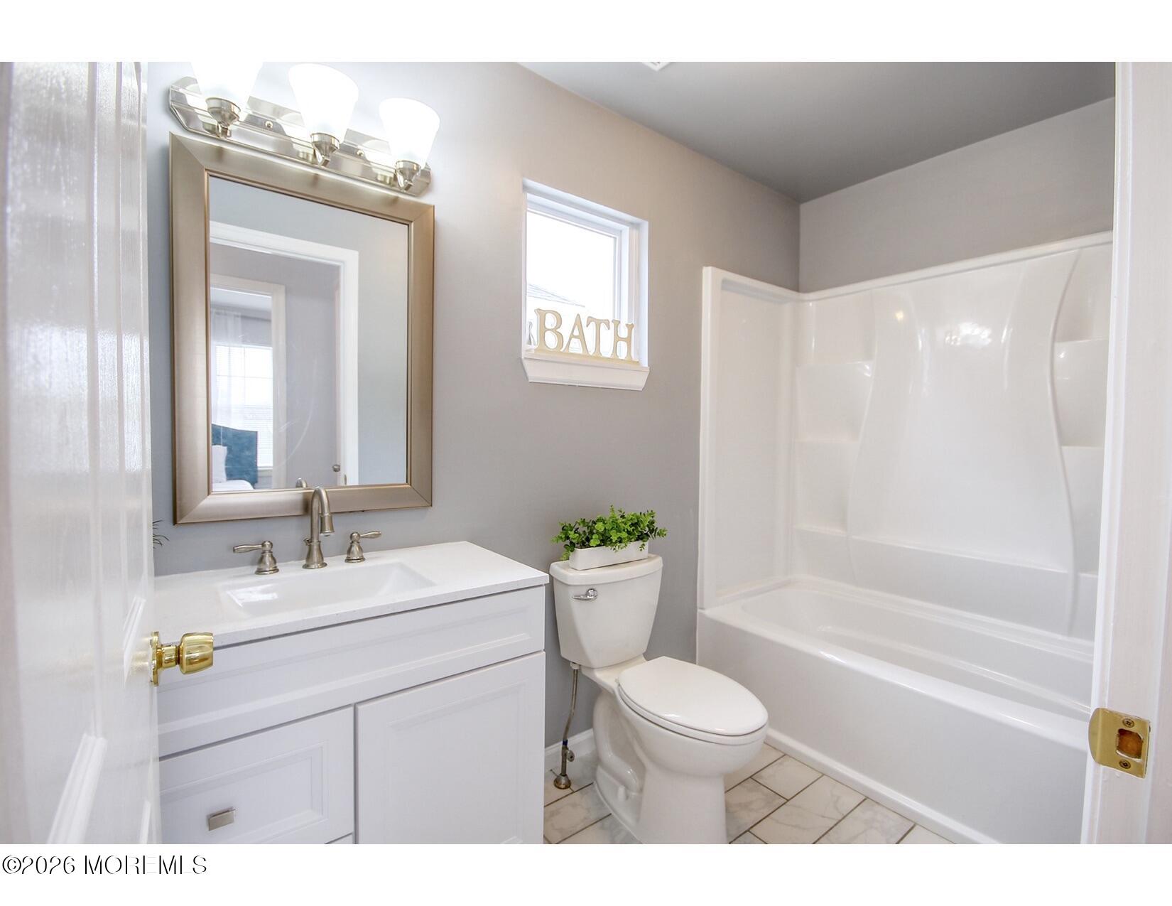 201 Arnold Avenue Point Pleasant Beach, NJ 08742 - Photo 27 of 33 a bathroom with a sink a toilet and shower