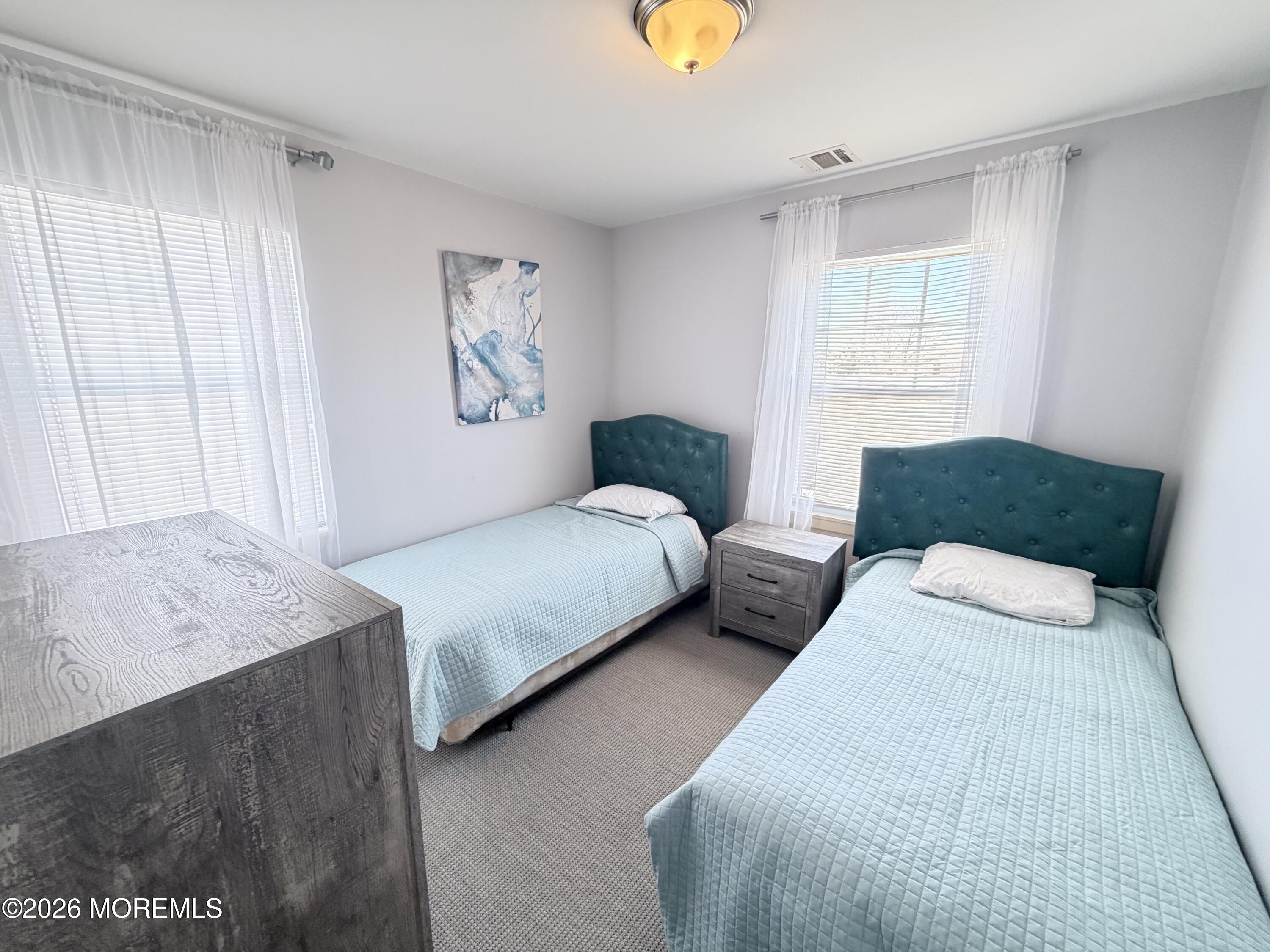 201 Arnold Avenue Point Pleasant Beach, NJ 08742 - Photo 29 of 33 a bedroom with two beds and a window