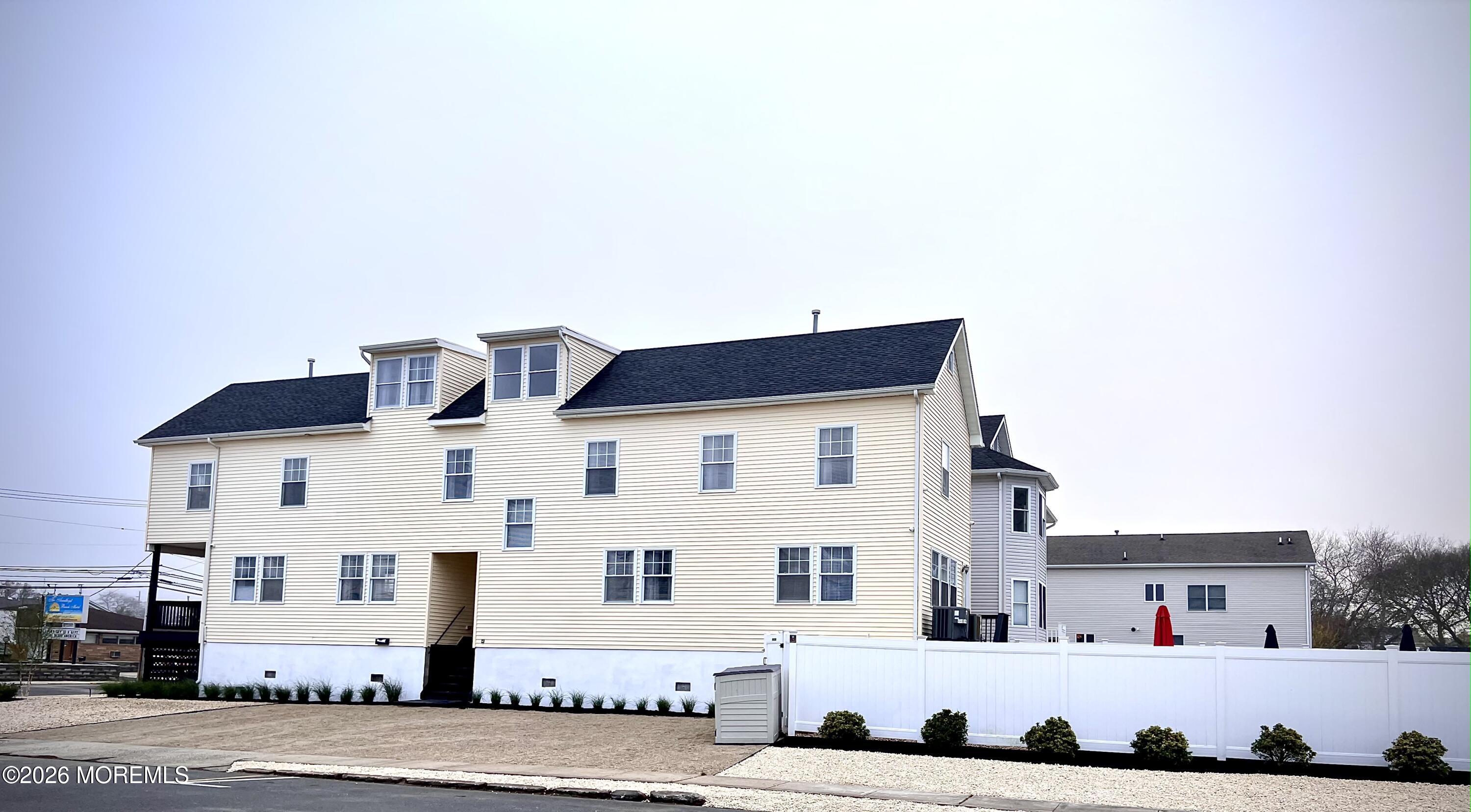 201 Arnold Avenue Point Pleasant Beach, NJ 08742 - Photo 3 of 33 a view of white house with a outdoor space