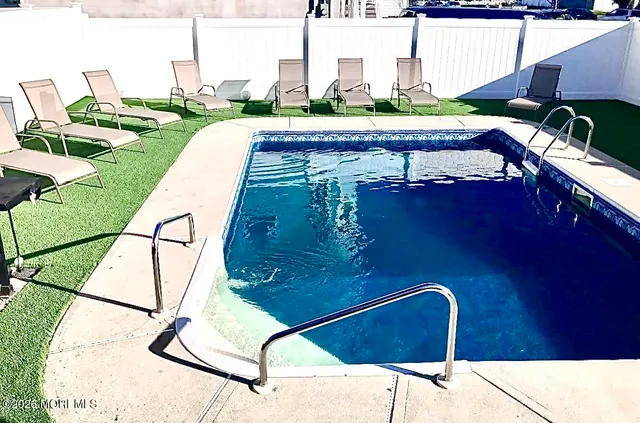 a view of swimming pool outdoor seating