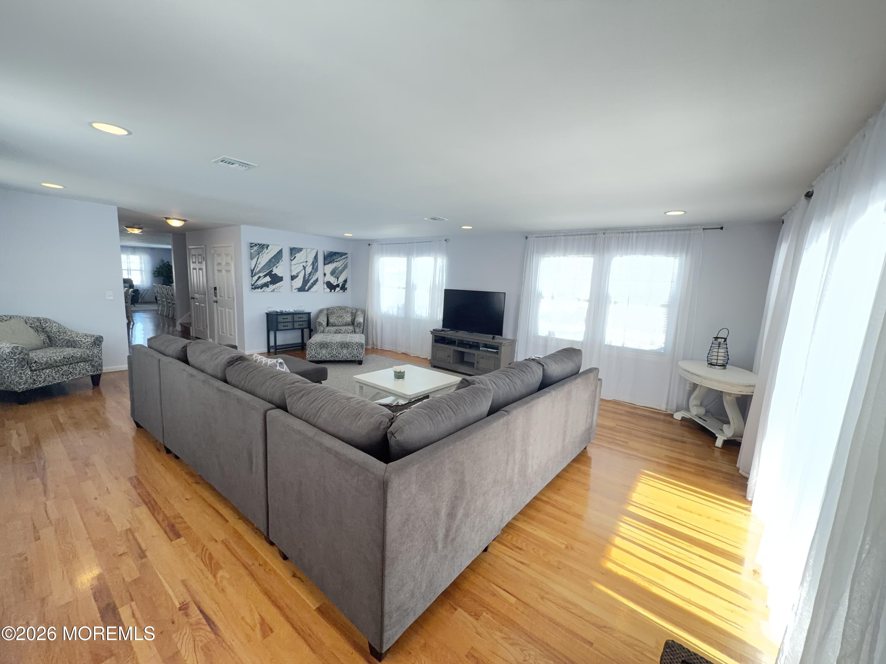 201 Arnold Avenue Point Pleasant Beach, NJ 08742 - Photo 6 of 33 a living room with furniture and a wooden floor