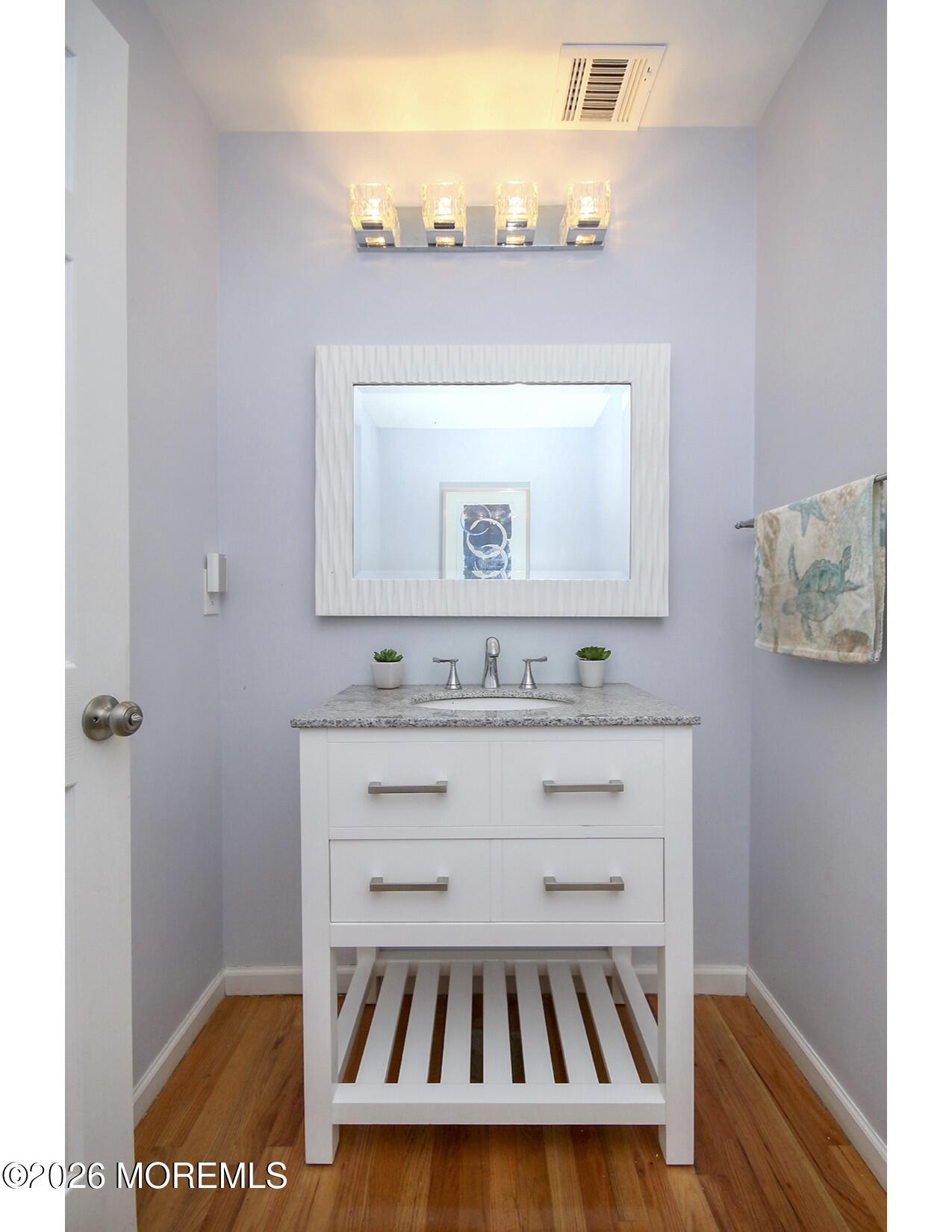 201 Arnold Avenue Point Pleasant Beach, NJ 08742 - Photo 9 of 33 a bathroom with a sink and a mirror