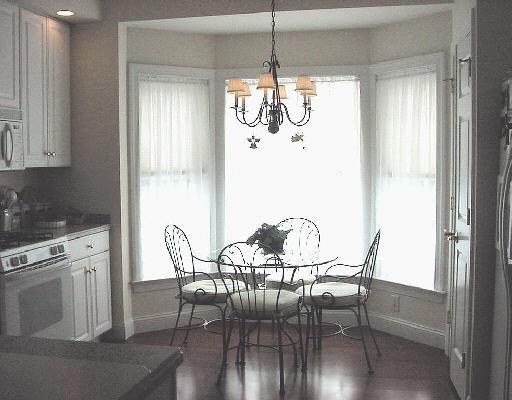 10 Hayestown Road, Unit 31 Danbury, CT 06811 - Photo 1 of 1 a view of a dining room with furniture window and wooden floor