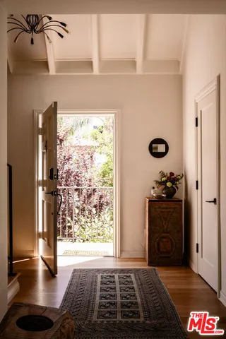 a view of an entryway with a hardwood floor
