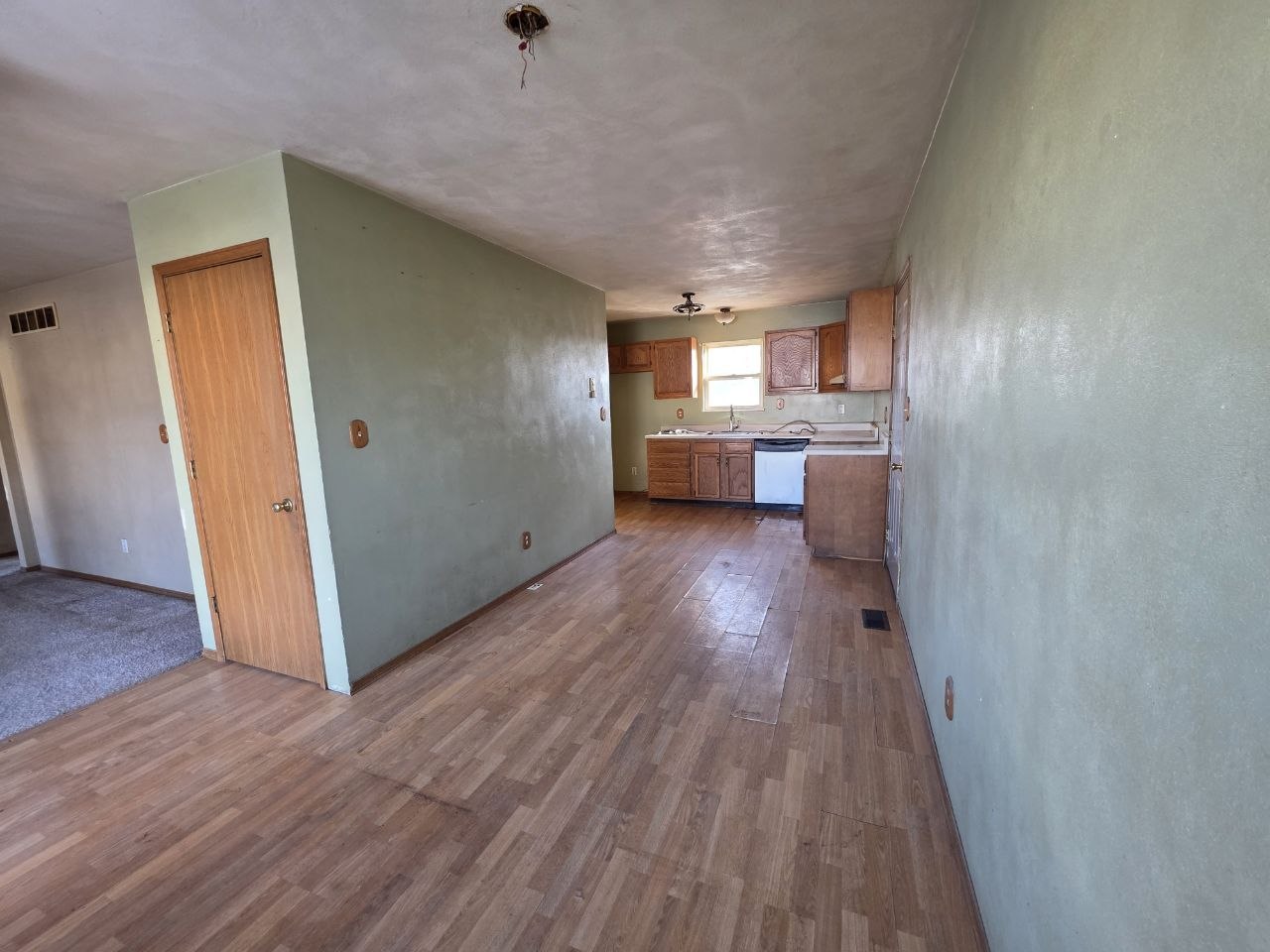 310 West 4th S Street Mount Olive, IL 62069 - Photo 5 of 10 a view of a hallway to kitchen and wooden floor