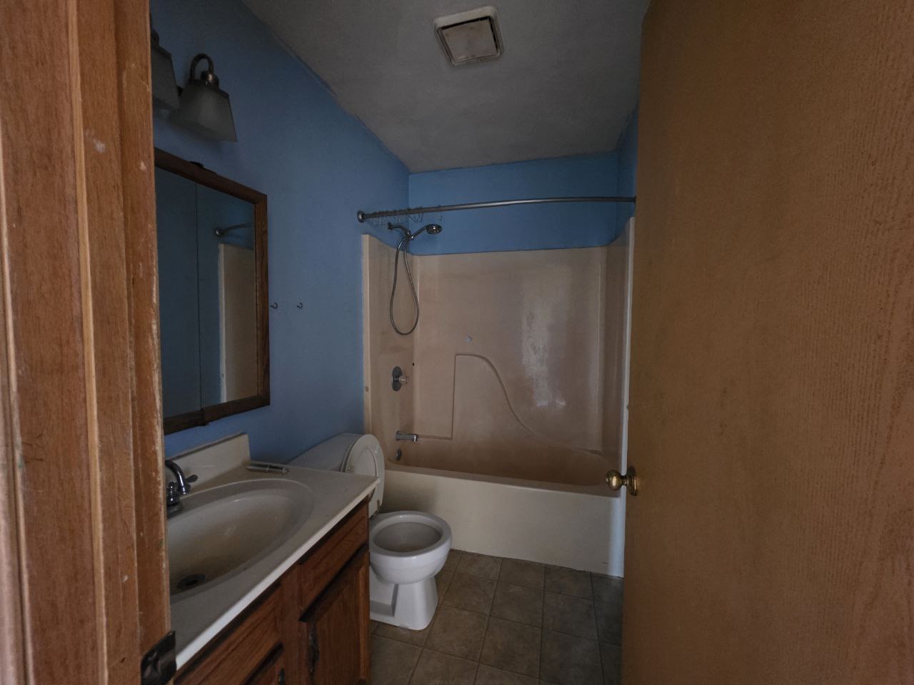 310 West 4th S Street Mount Olive, IL 62069 - Photo 7 of 10 a bathroom with a granite countertop sink toilet and shower