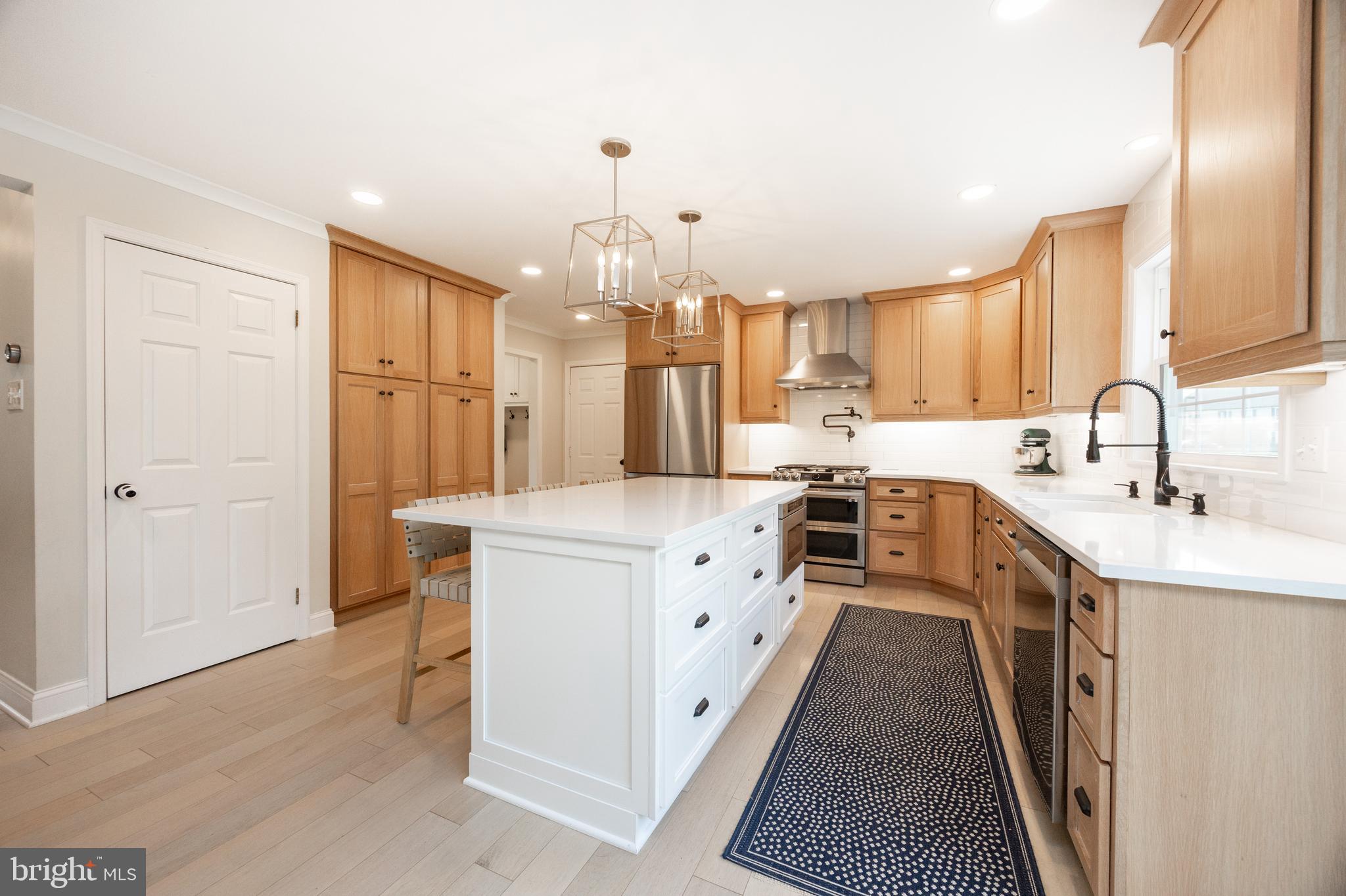 101 Ashley Road Phoenixville, PA 19460 - Photo 12 of 41 a kitchen with kitchen island granite countertop a sink a counter top space stainless steel appliances and cabinets