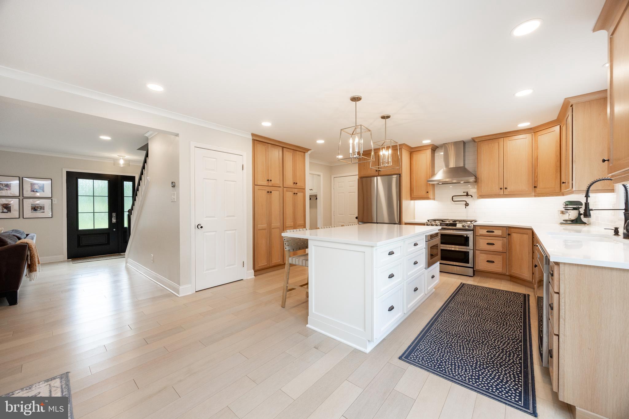 101 Ashley Road Phoenixville, PA 19460 - Photo 13 of 41 a kitchen with white cabinets and stainless steel appliances