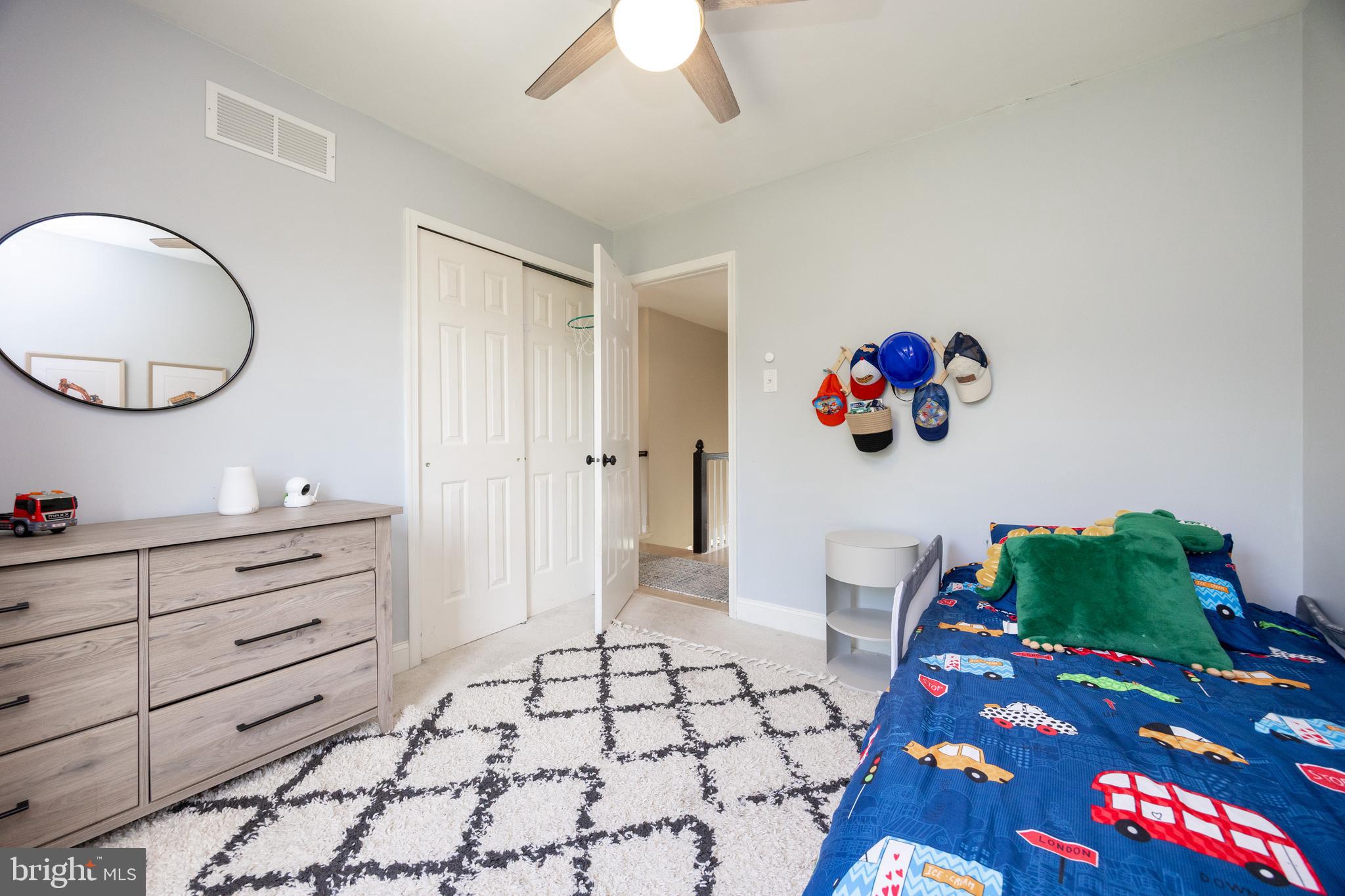 101 Ashley Road Phoenixville, PA 19460 - Photo 25 of 41 a bedroom with a bed and a chandelier
