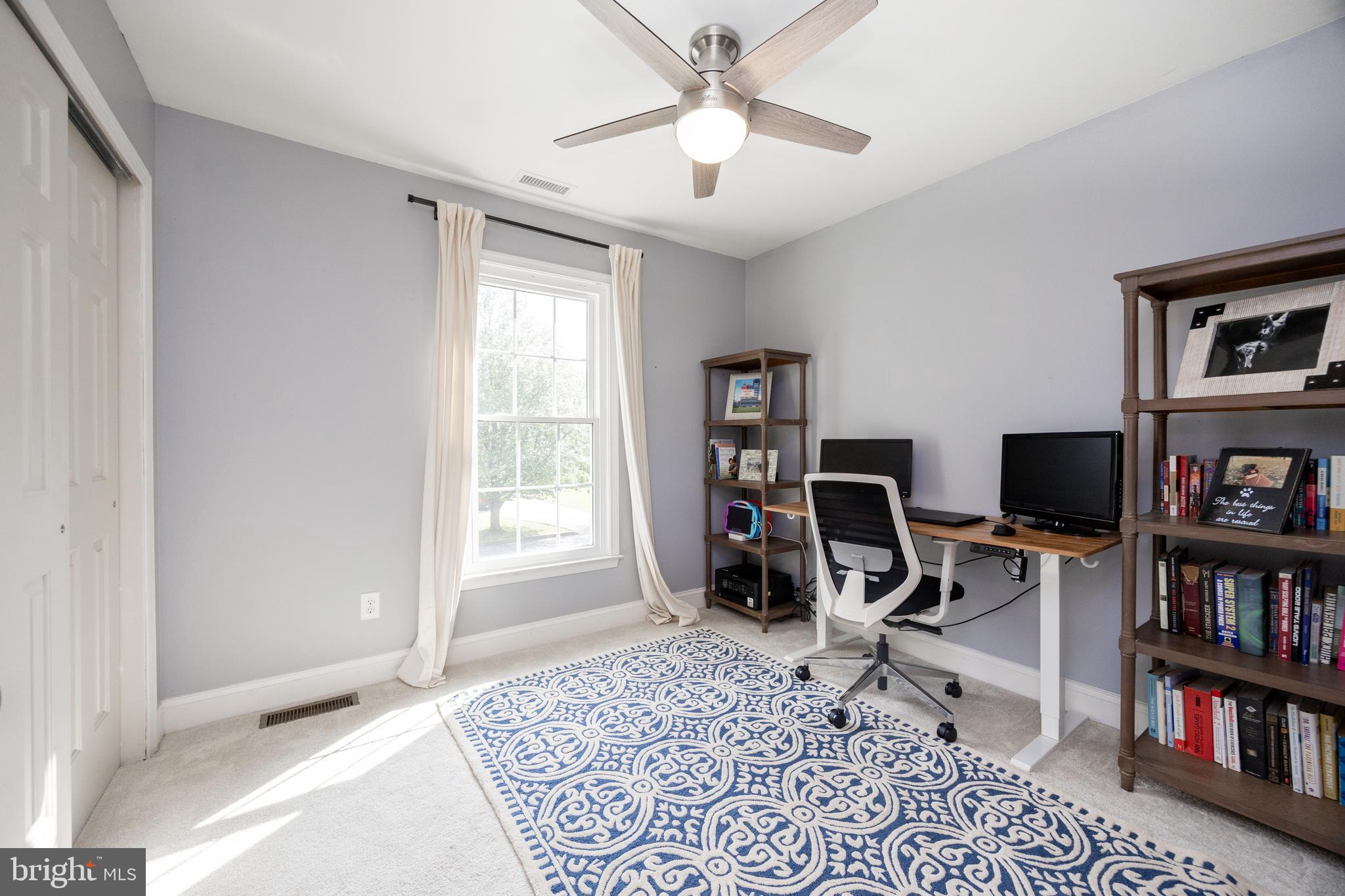 101 Ashley Road Phoenixville, PA 19460 - Photo 26 of 41 a view of a workspace with furniture and a book shelf