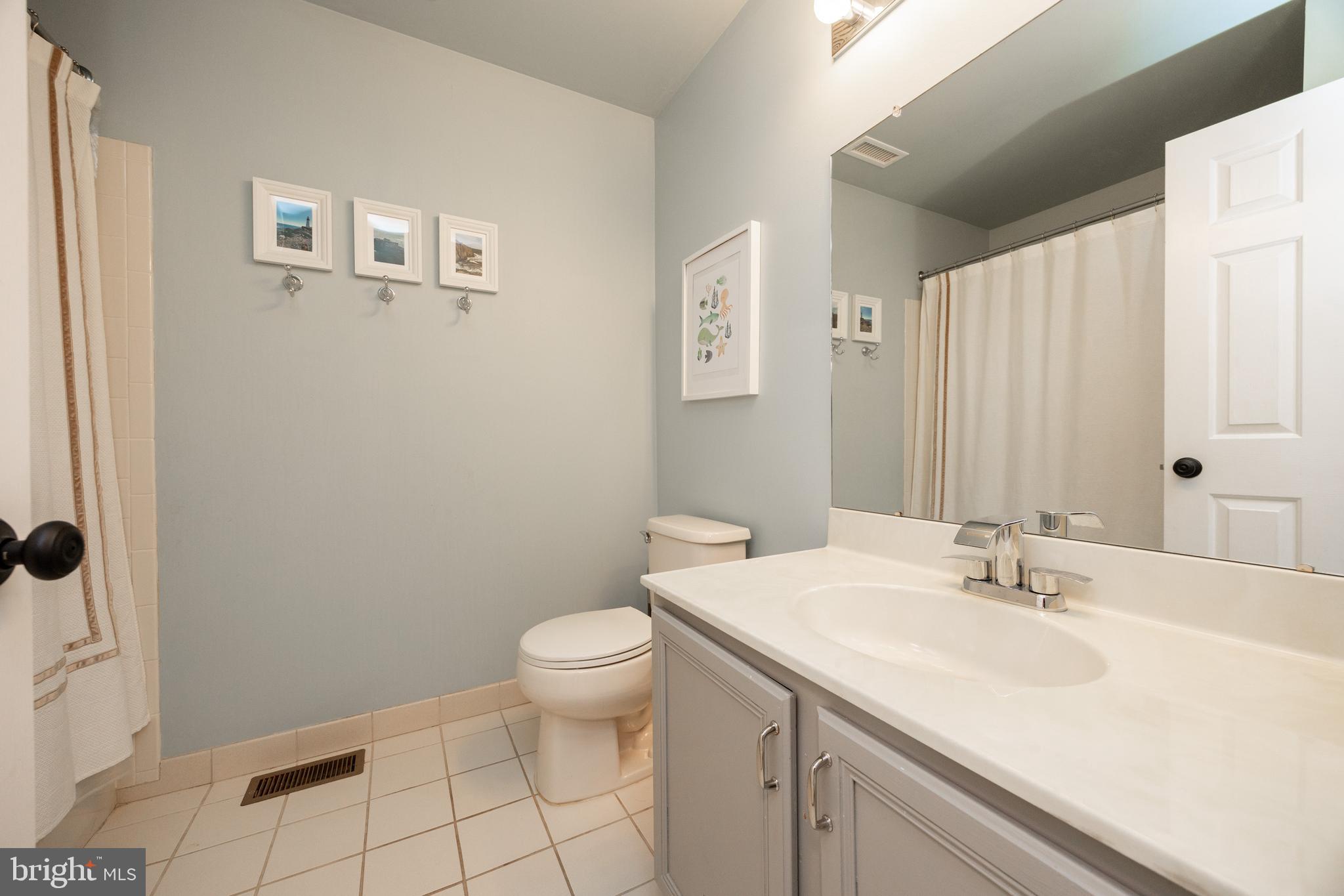 101 Ashley Road Phoenixville, PA 19460 - Photo 27 of 41 a bathroom with a sink toilet and vanity