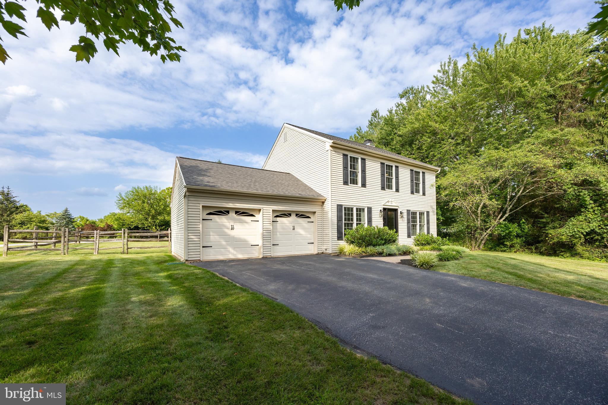 101 Ashley Road Phoenixville, PA 19460 - Photo 41 of 41 a front view of a house with a yard and trees