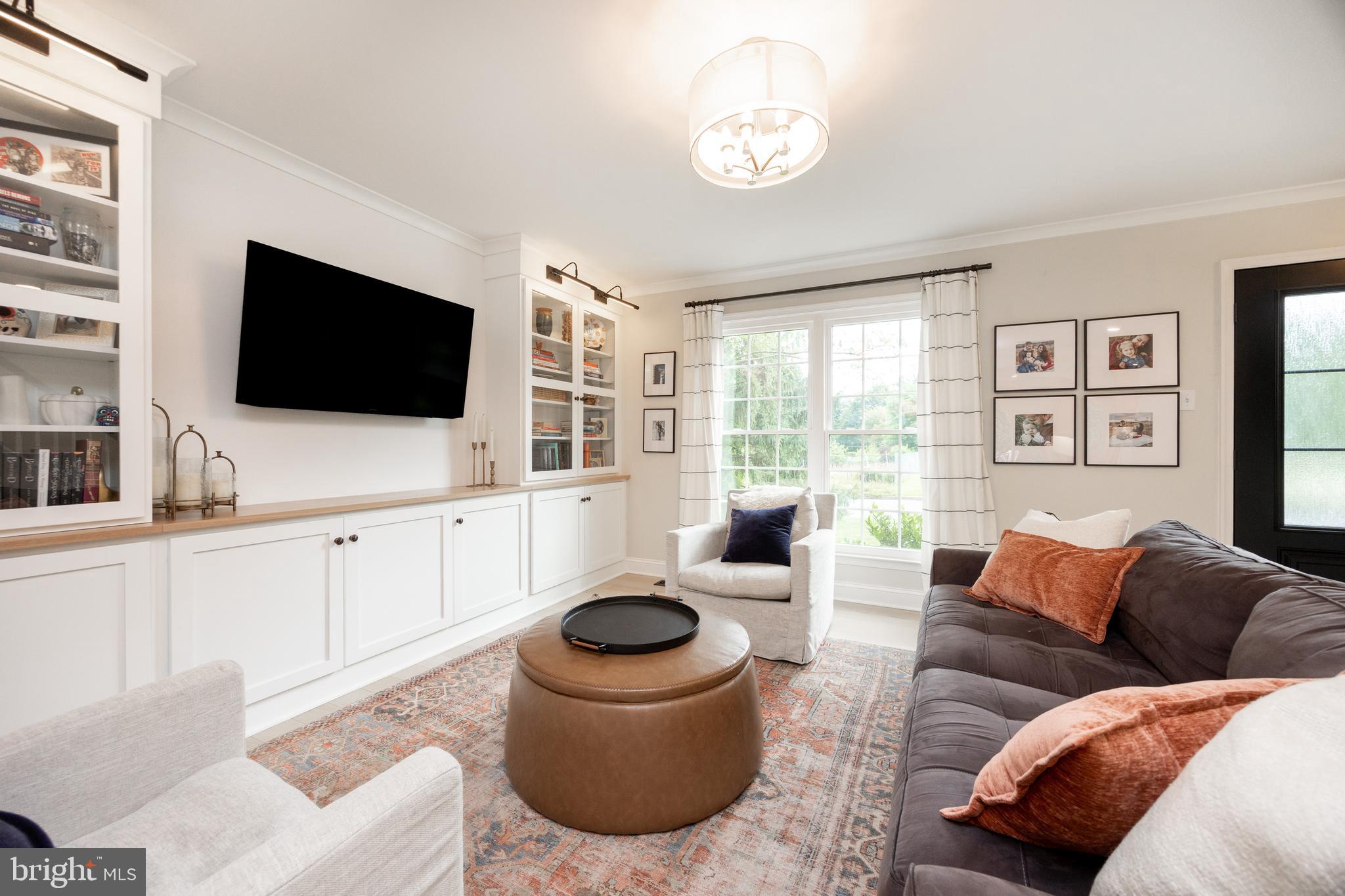 101 Ashley Road Phoenixville, PA 19460 - Photo 5 of 41 a living room with furniture and a flat screen tv