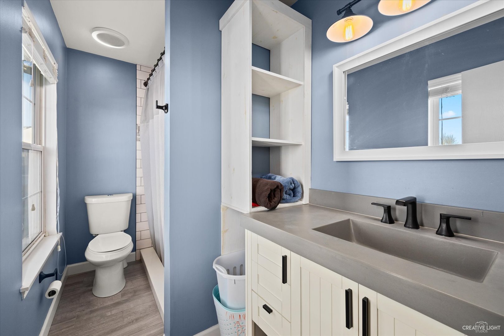 4020 Foli Street Plano, IL 60545 - Photo 11 of 17 a bathroom with a toilet sink and mirror