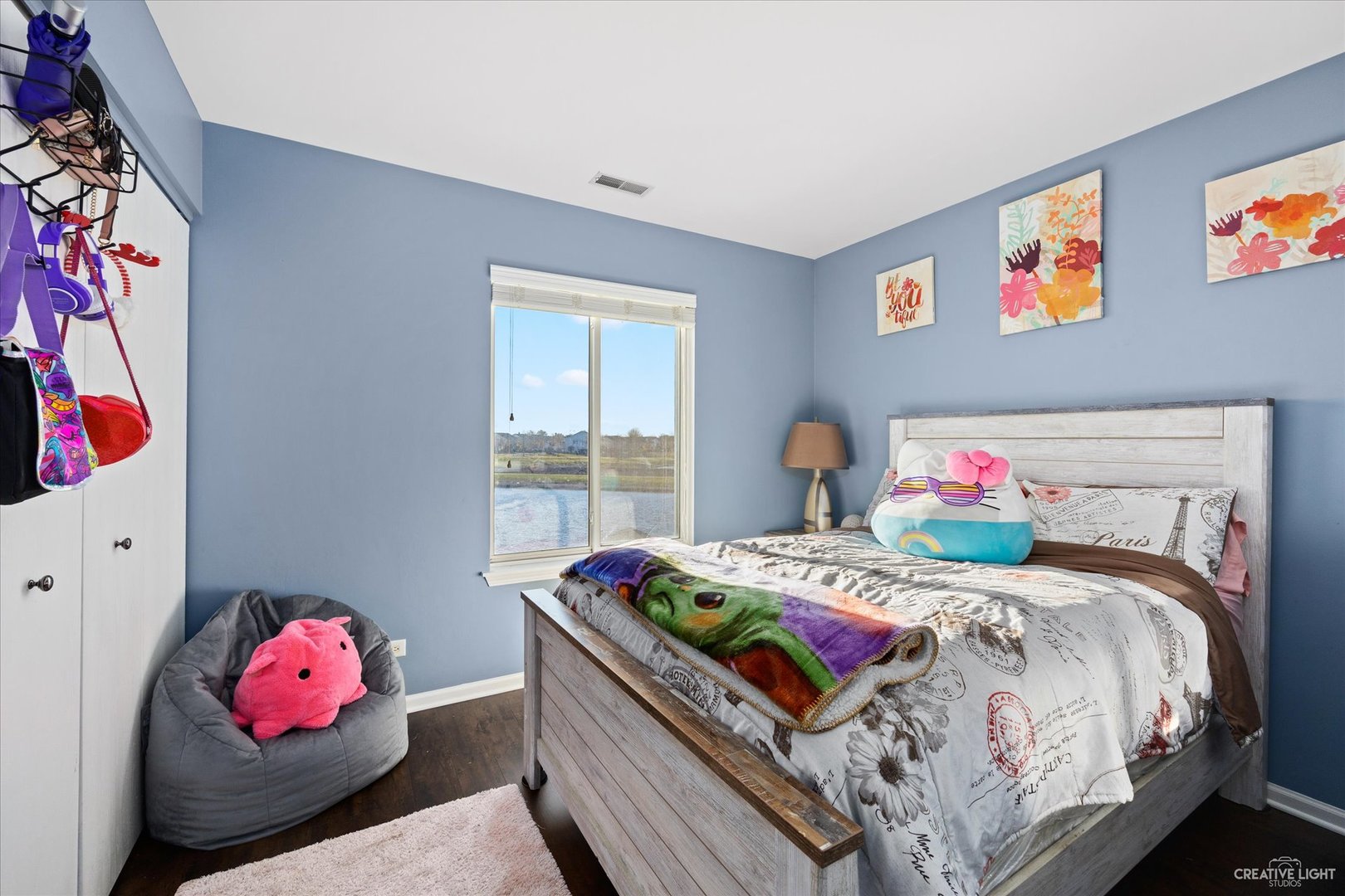 4020 Foli Street Plano, IL 60545 - Photo 12 of 17 a bedroom with a bed and wooden floor
