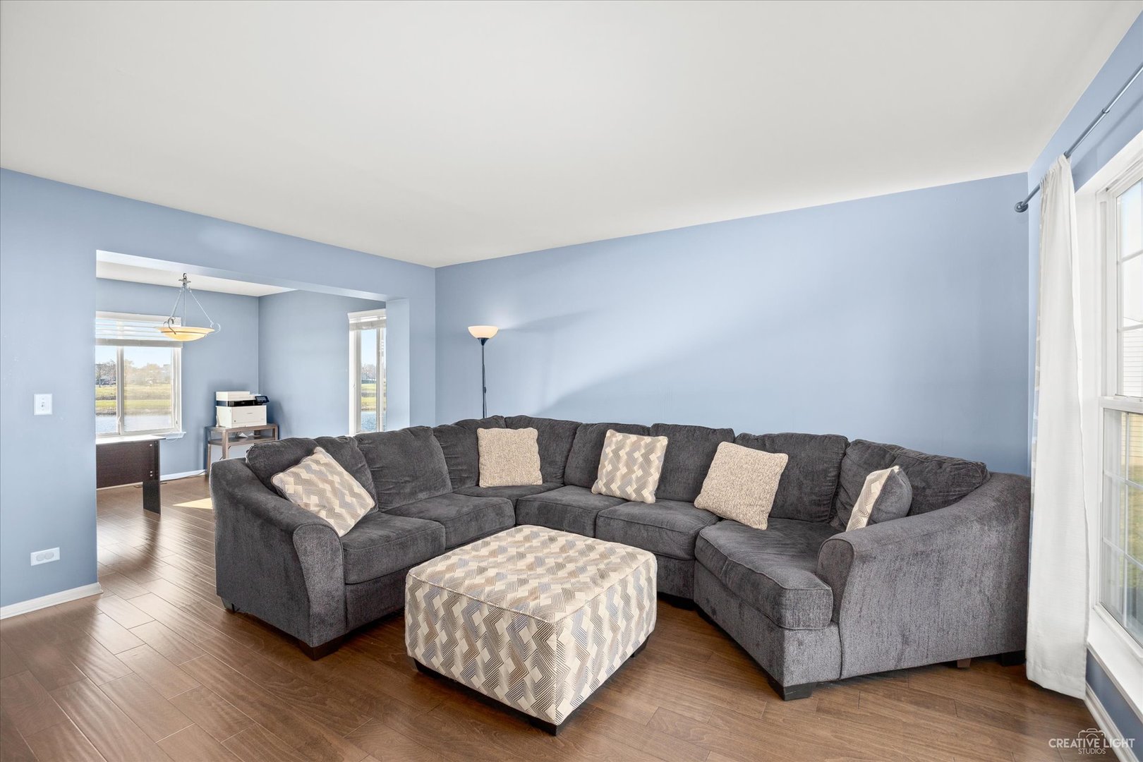 4020 Foli Street Plano, IL 60545 - Photo 3 of 17 a living room with furniture and a wooden floor