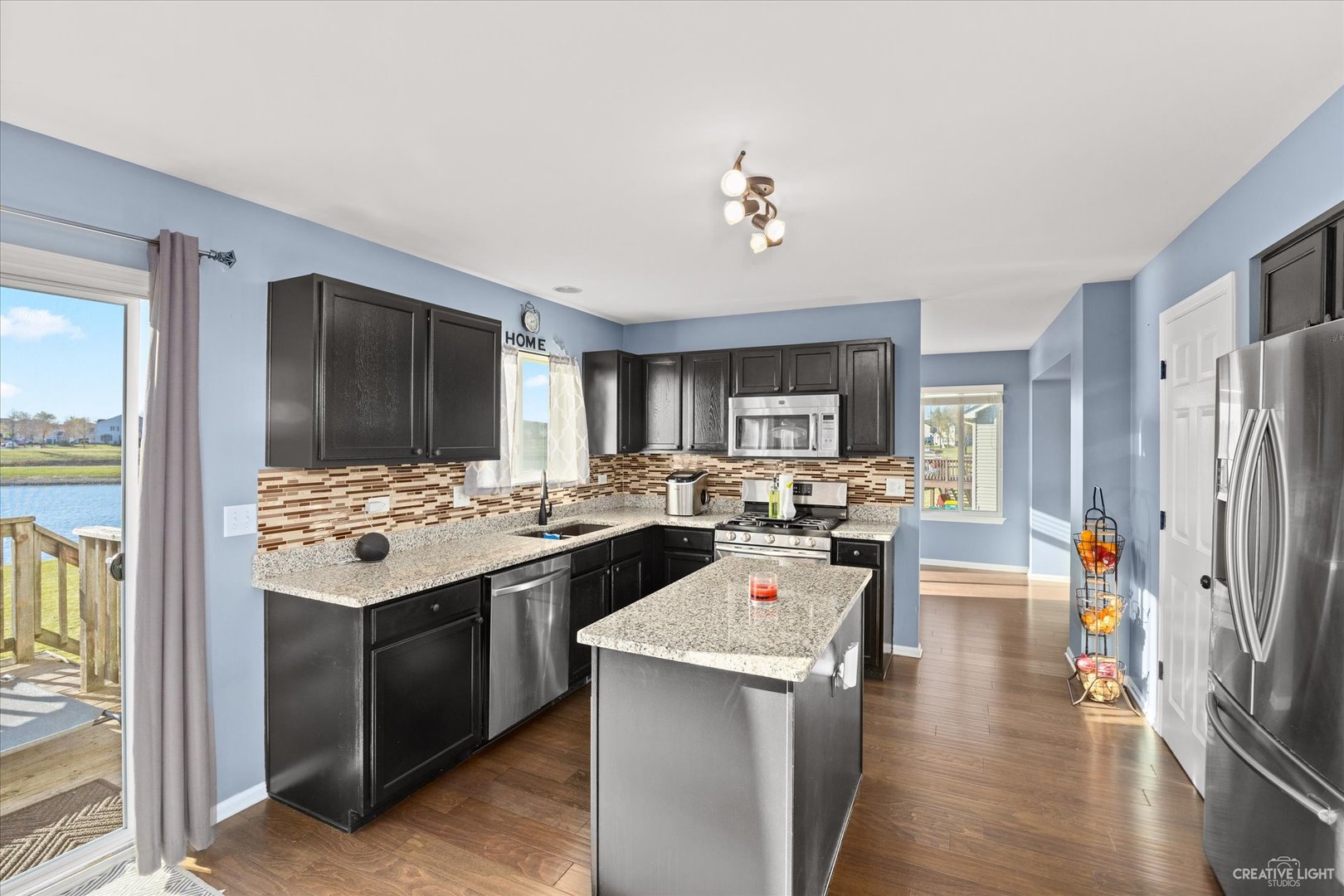 4020 Foli Street Plano, IL 60545 - Photo 5 of 17 a kitchen with a stove and refrigerator