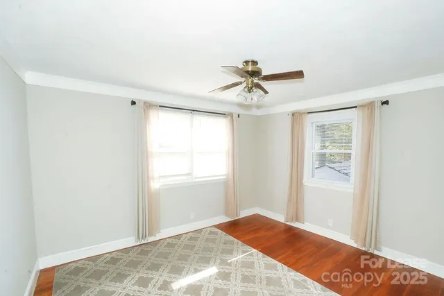a view of a bedroom with a workspace