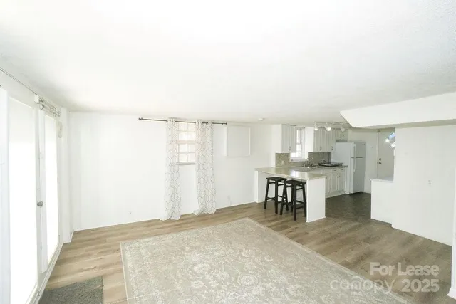a view of kitchen with furniture and window