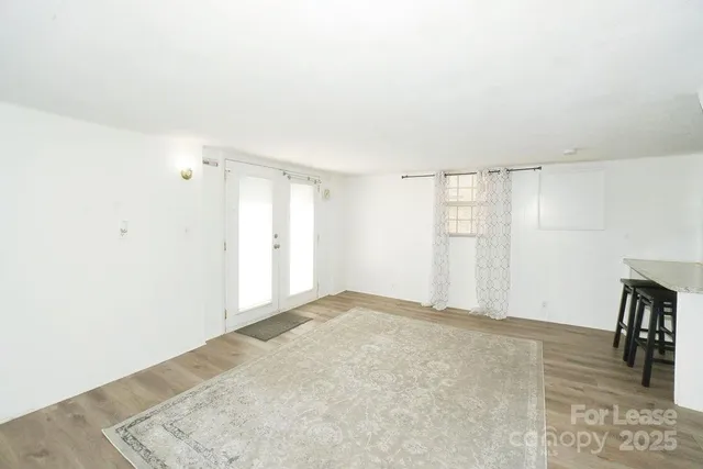 a view of livingroom with hardwood floor and hallway