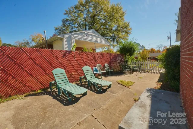 a view of a two chairs in the patio