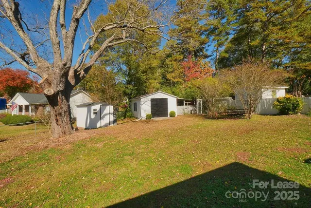 a front view of a building with a yard