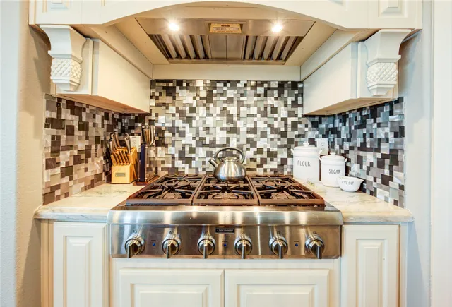 a view of a kitchen with granite countertop