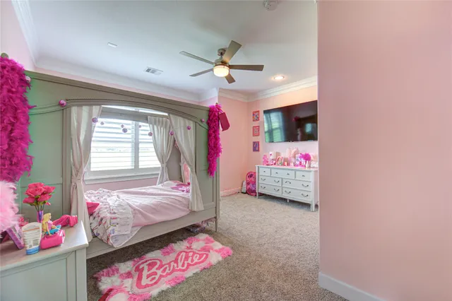 a living room with furniture a chandelier and a floor to ceiling window