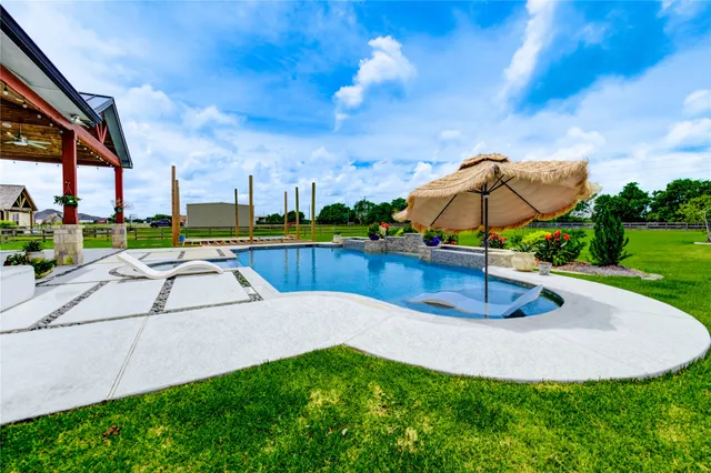a view of a garden with lawn chairs