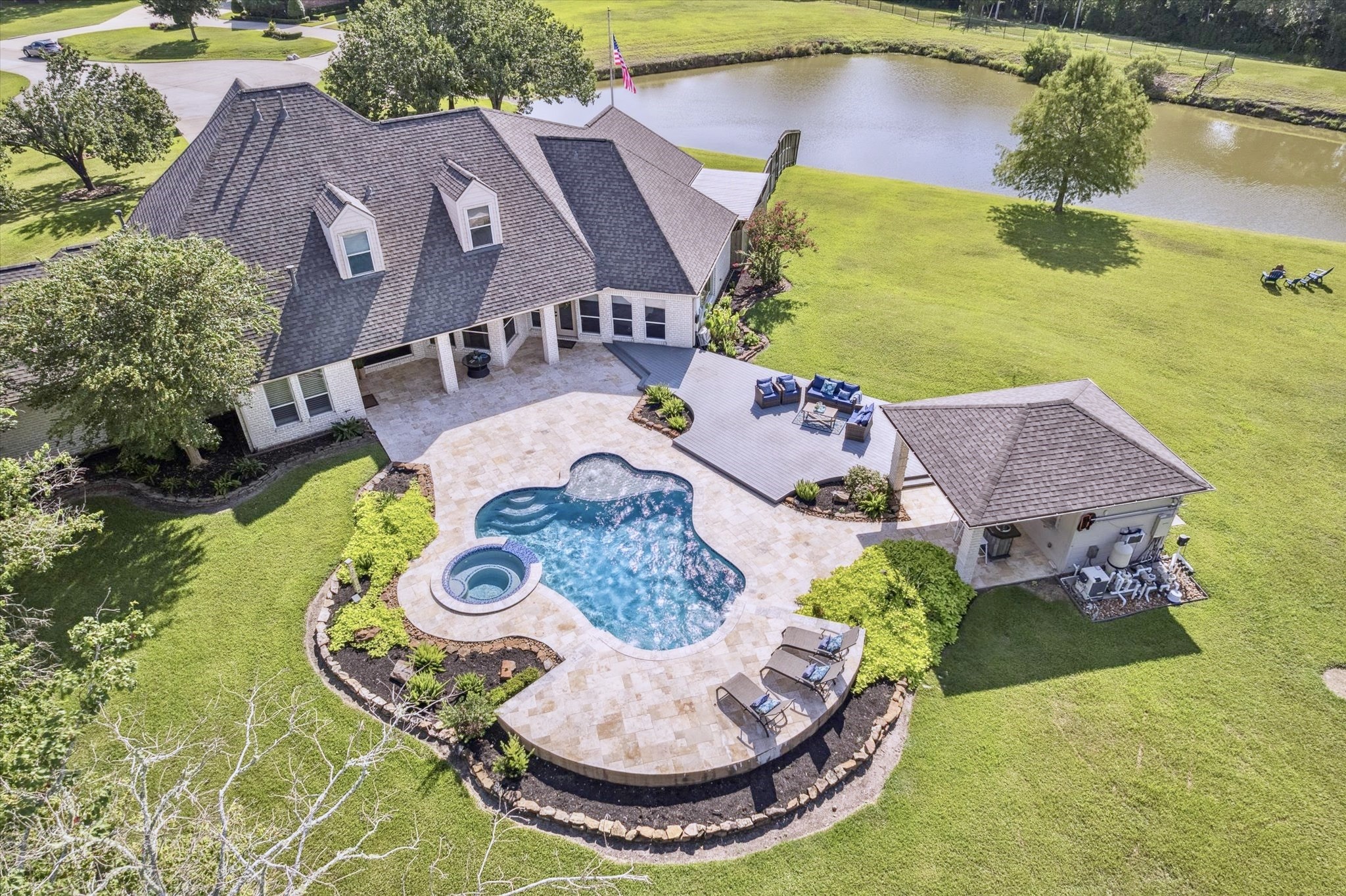 2904 Bridle Path Lane Friendswood, TX 77546 - Photo 2 of 49 Take advantage of this rare opportunity in Friendswood, a property that truly offers space, privacy, and natural beauty. No detail was overlooked. Enjoy it all every day: a stunning pool, a charming pool house, a stocked lake perfect for fishing, and serene green space surrounding you.