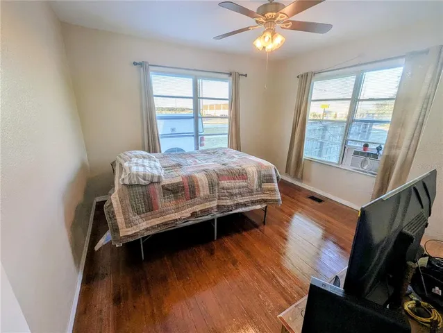 a bed room with a bed and window