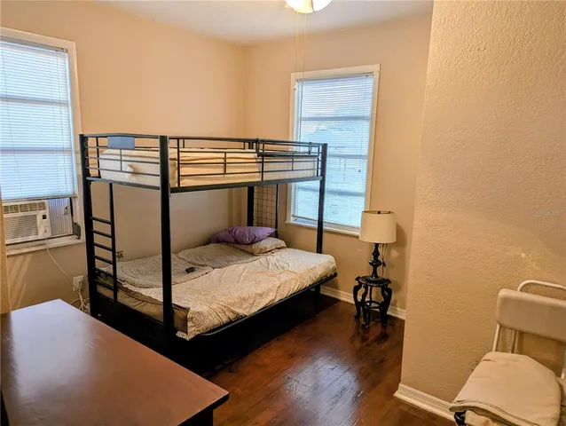 a bedroom with a bed and a table in it