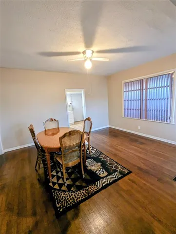 a living room with furniture rug and window