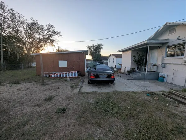 a view of a car park in front of house