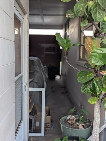 a vase of flowers sitting on a table with a fireplace