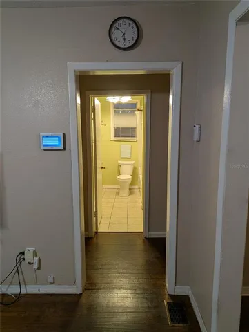 a view of an entryway with wooden floor