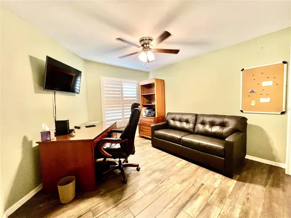a living room with furniture and a window