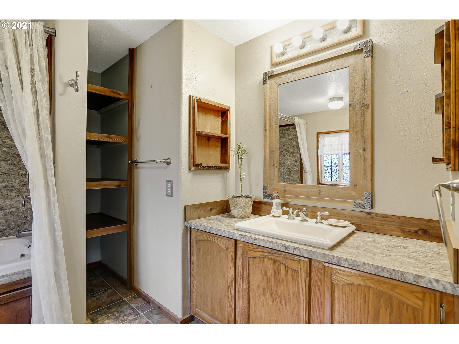 1725 Main Street Lyons, OR 97358 - Photo 16 of 32 a bathroom with a granite countertop sink and a mirror